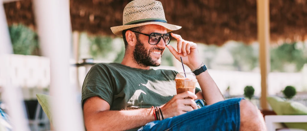 Man drinking iced coffee.jpg